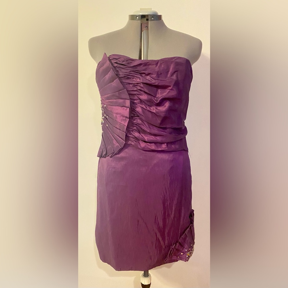 Strapless Dark Purple with beaded designs on the sides. Size 2XL.